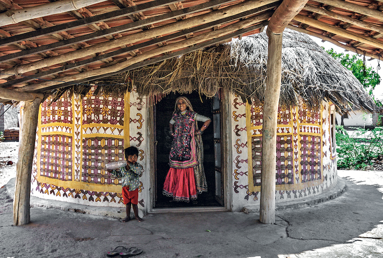 Bhungas at Ludiya, Kachchh, Gujarat. The circular plan and lightweight thatch roof make for an ideal earthquake resistant design.