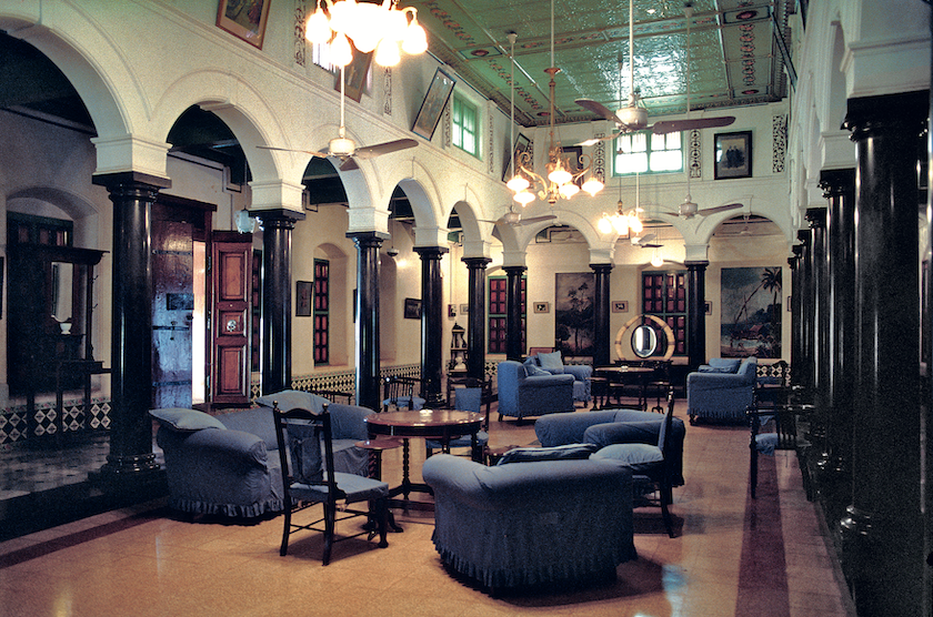 Dining and living rooms in a Chettiar mansion including one with clerestory windows above the upper storey passage around the space, for letting in more light.